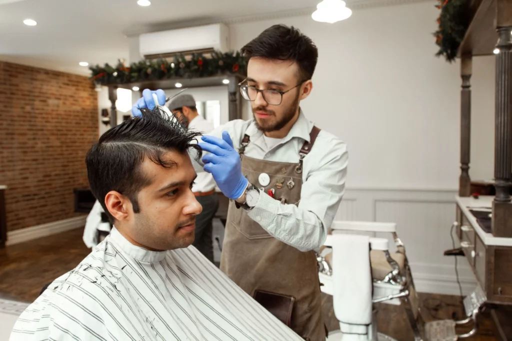 Antony Performing Hair Cutting on a customer at Antony Locke Barbers